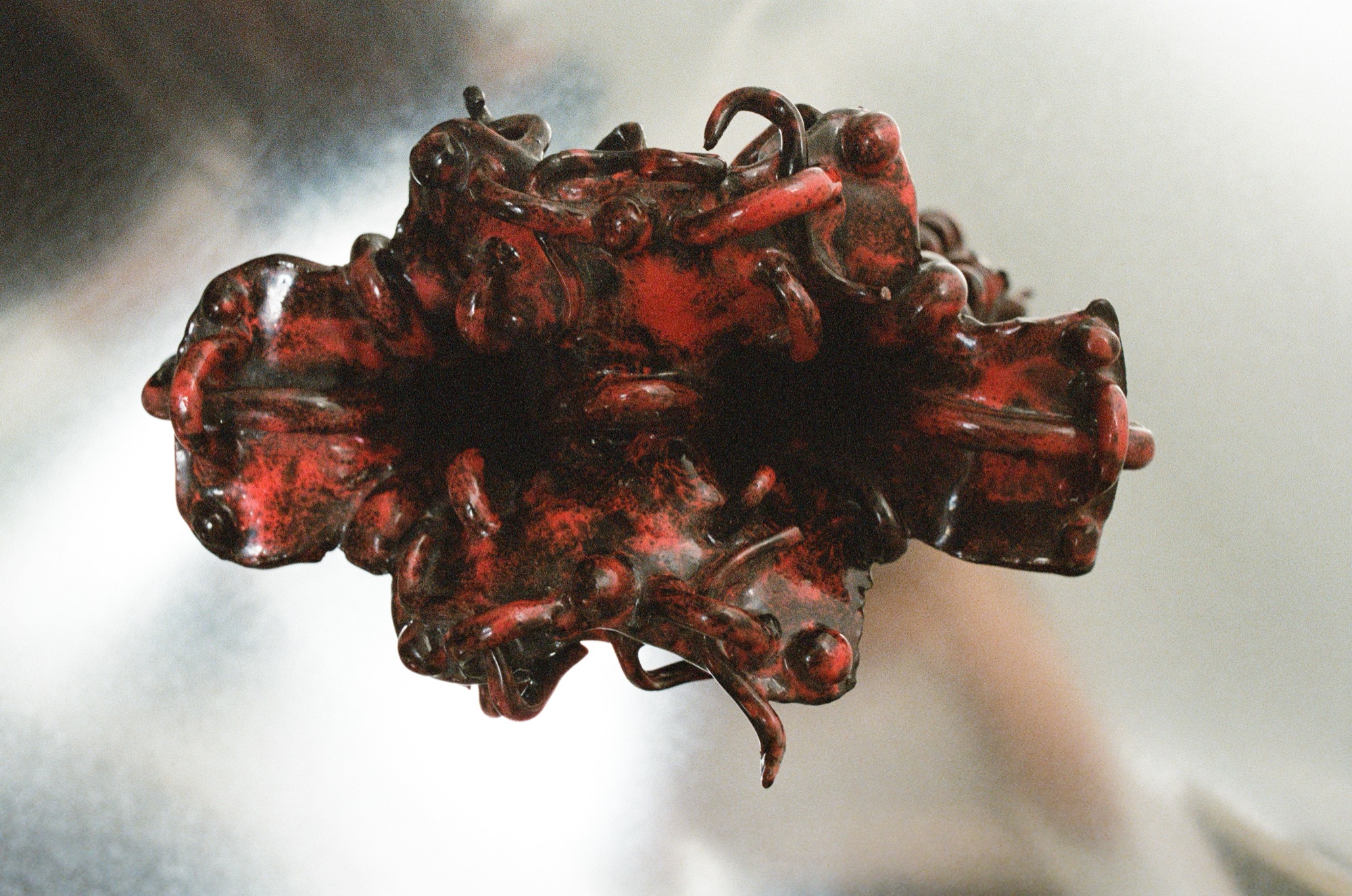 Red braided ceramic vessel, front view