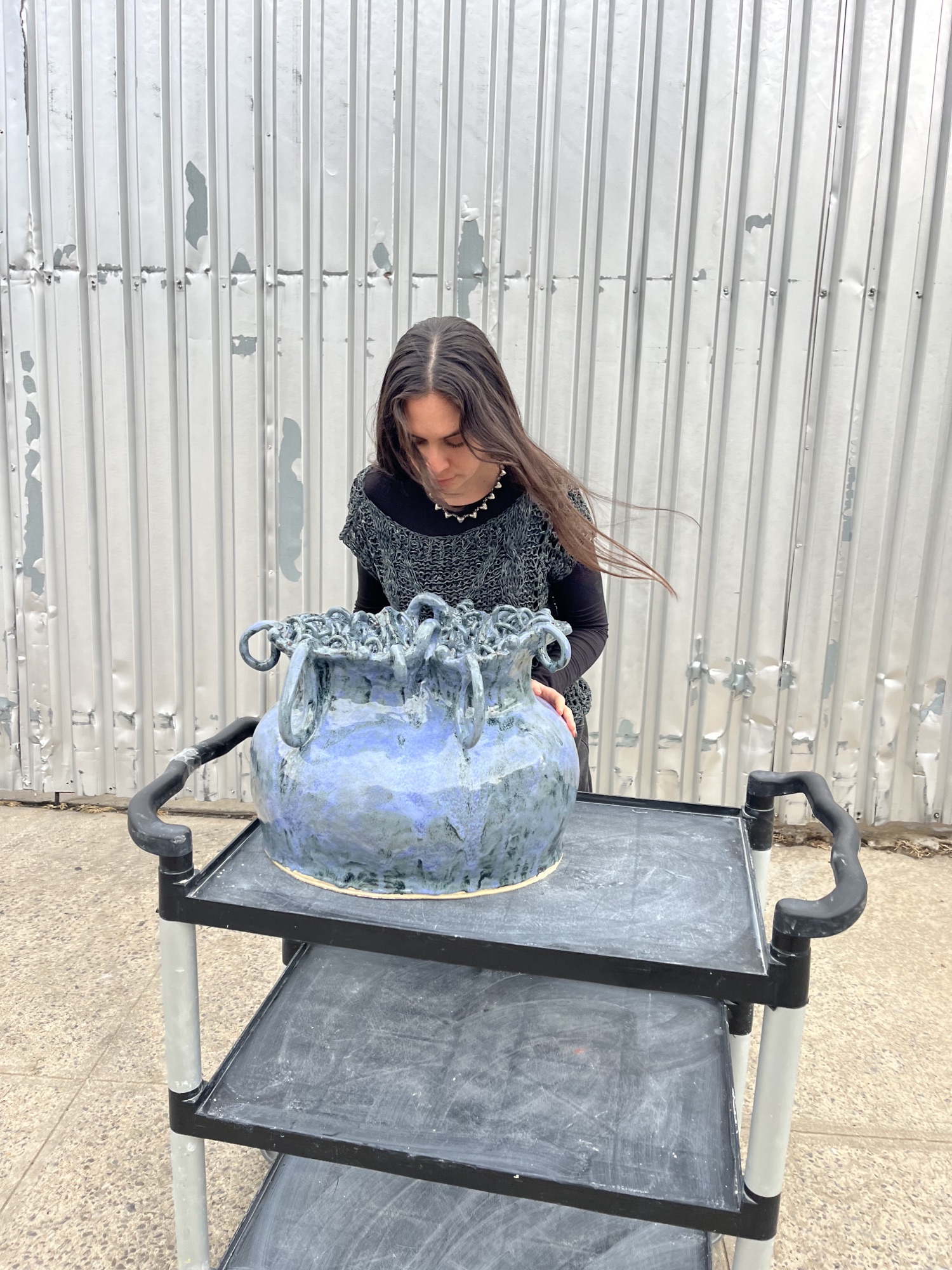 Taylor Brophy with her ceramic work